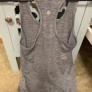LULULEMON size 4, swiftly tech racerback gray.